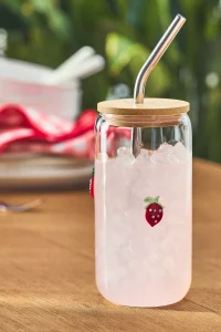 A clear Icon Juice Glass Tumbler with Lid featuring a playful design (e.g., lips or chili peppers). A top rated Anthropologie gift and TikTok favorite.